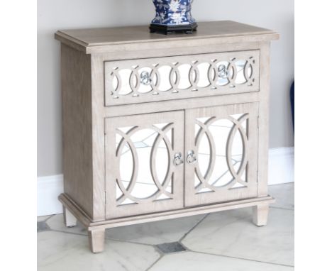 A limed oak side cabinet in the Art Deco taste - modern, the cavetto moulded top over a single frieze drawer and pair of cupb