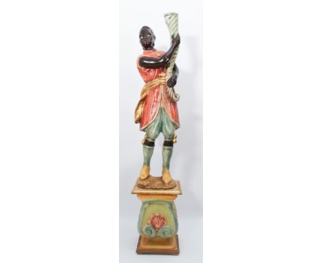 A polychrome painted and parcel gilt composite Blackamoor torchere - late 20th century, the figure standing upon a shell and 
