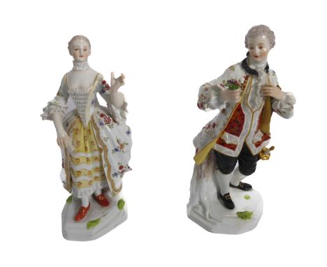 A pair of early 20th century Meissen porcelain figures&nbsp;of a lady and gallant - in 18th century dress, he modelled with a