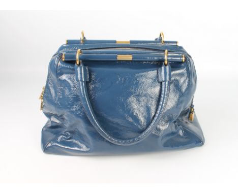 A blue patent leather shoulder bag by Yves Saint Laurent - with brushed gold toned hardware, two bar-mounted top handles, zip