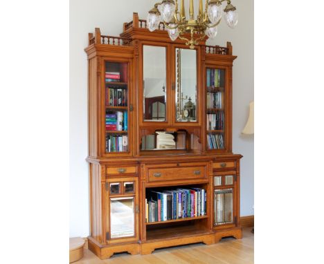 A fine quality late-Victorian Arts & Crafts style honey oak breakfront secretaire library bookcase - of imposing proportions,