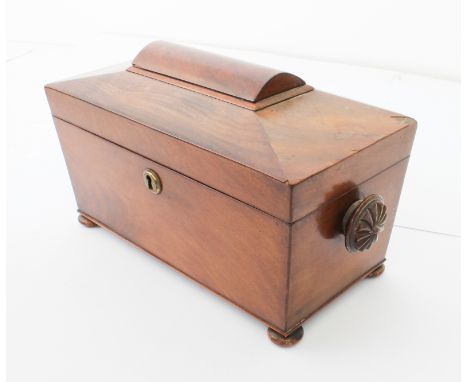 A mid-19th&nbsp;century mahogany sarcophagus tea caddy - with fan carved handles and turned bun feet, the interior with remov