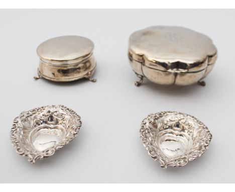 Two silver trinket boxes - one by E. S. Barnsley & Co., Birmingham 1912, of eight lobed form, raised on three lion paw feet; 