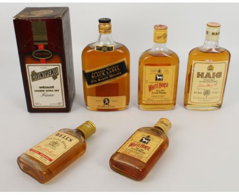 A small collection of vintage bottles of blended Scotch whisky - Johnnie Walker Black Label Extra Special, 50cl; Haig Fine Ol