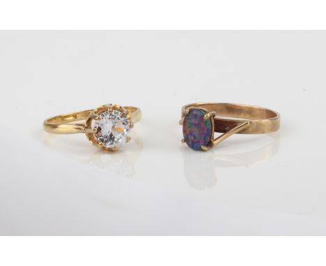 Two 9ct gold stone set rings - comprising an opal triplet ring with twist setting, marked '9CT', size K&frac12;; and a CZ sol