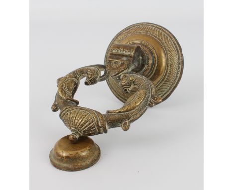 An Indian brass door knocker, circular back plate 10.7 cm diameter.