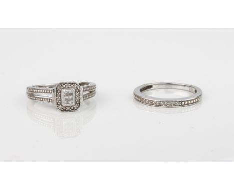 A 9ct white gold and diamond engagement ring with matching eternity ring - both stamped '9K', with a central plaque of six pr