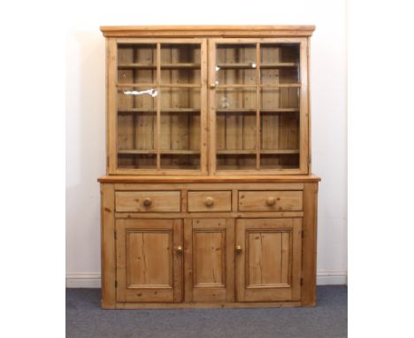 A Victorian and later waxed pine glazed dresser - the moulded cornice over a pair of four-pane glazed doors, enclosing three 