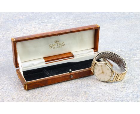 A Smiths De Luxe 9ct gold manual wind gentleman's wrist watch - hallmarked London 1962, with gilt 17 jewel 27.CS movement, si