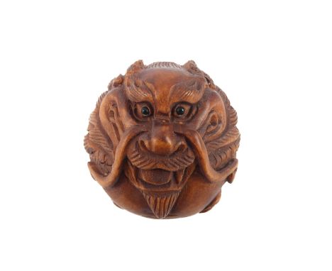A carved boxwood netsuke