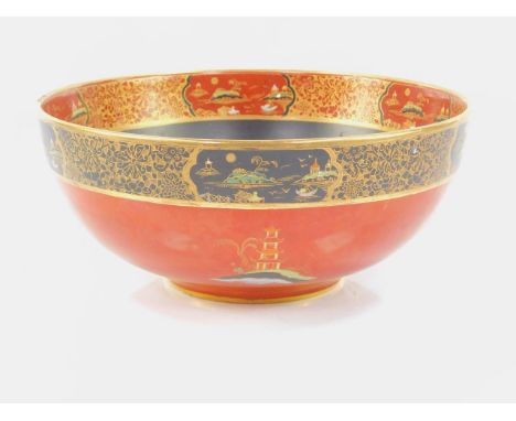 A Carltonware early 20thC pottery bowl, with chinoisserie decoration against a black and rust red ground, 23.5cm dia.