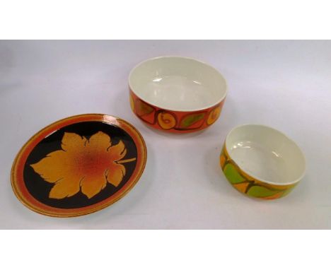 A Poole pottery Aegean plate, decorated with a leaf and two Delphis pottery fruit bowls, 20cm and 13cm diameter (3)