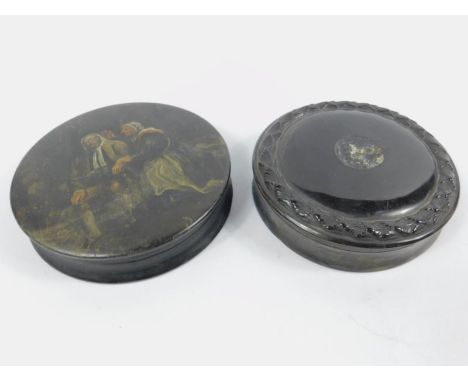 Two Georgian circular patch boxes, one painted with an elderly couple on black lacquer, the other carved horn (2)