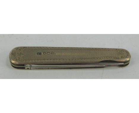 A silver backed pocket knife, with two blades and folding scissors, with engine turned decoration, reserve plated named T.F M