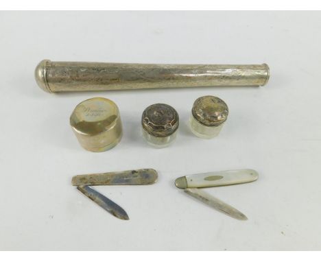 A George V silver folding fruit knife, Sheffield 1928, another mother of pearl bound, Sheffield 1916, two silver lidded ointm