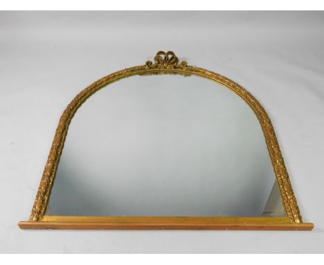 A Victorian gilt wood and gesso over mantel mirror, with bow and wreath decoration, 130cm long x 127cm high.