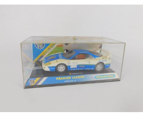 A Scalextric Premier League Chelsea FC model of a Ferrari F40, Premier Edition, boxed, and a Crystal Classics scale model of 