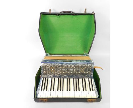 A Hohner Verdi III accordian, blue mother of pearl type case, one hundred and twenty buttons, cased.