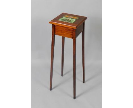 A Victorian mahogany jardiniere stand, with tile inset raised on tapering square legs, 28cm x 28cm x 90cm.