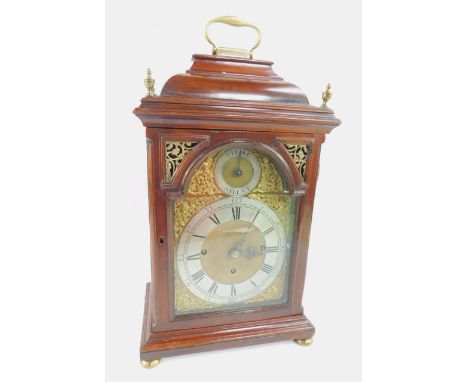 A George III mahogany cased bracket clock, brass break and dial, with mask and figural spoundrels, silvered chapter ring, bea