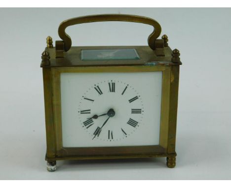 A French rectangular brass cased carriage clock, enamel dial bearing Roman numerals, integral key, 9.5cm x 5cm x 8.5cm.
