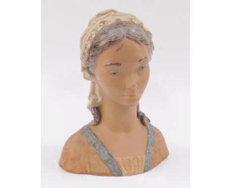 A Lladro matt porcelain bust of a girl wearing a cap, printed marks, 33cm high.