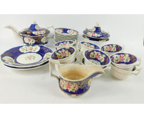A 19thC Gaudy Welsh pottery tea service, with floral reserve decoration against a blue ground, comprising teapot, slop bowl, 