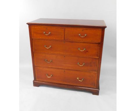 An Edwardian mahogany chest of drawers, with satinwood cross banding and boxwood and ebony line inlay, two short over three l
