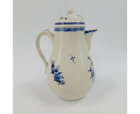 A late 18thC pearlware jug and cover, decorated in blue and white with floral sprays, the lid with acorn finial, 25cm high.