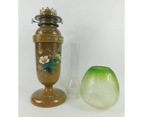 A Wills & Jones late 19thC brown glass oil lamp, No 893, numbered 193, enamel decorated with mead on flowers and a butterfly,