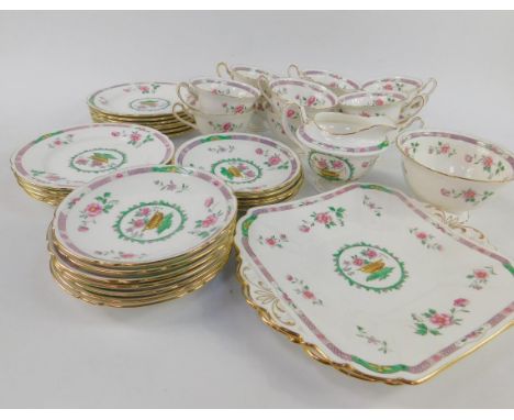 A Shelley porcelain tea service, decorated with urns and sprigs of flowers, pattern no.11298, comprising of a pair of bread p