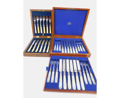 A set of twelve plated fruit knives and forks, with mother of pearl handles, mahogany cased, and a set of six fish knives and