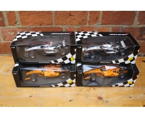 A collection of four Minichamps 1:18 scale, ltd edition McClaren Mercesdes F1 class