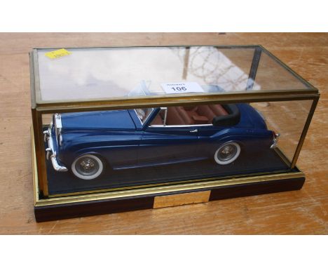 A scale diecast model of a Rolls-Royce Silver Cloud MkII drophead, with metallic blue coachwork in a gilt metal framed displa