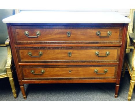 A late 18th century French commode, the shaped marble top over a mahogany three drawer base flanked by fluted columns, 114cm 