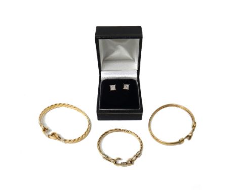 A 9ct gold and colourless gem set bangle, with a loop and hook clasp, a 9ct gold bangle, in a cable design, with a loop and h