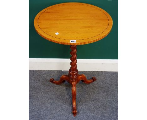 A Victorian satinwood circular tripod table, on barleytwist column and three downswept supports, 51cm wide x 73cm high.