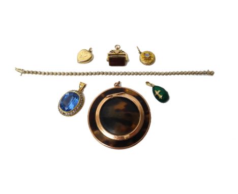 A gold mounted circular hinge lidded case, detailed 9 CT, a 9ct gold and diamond set line bracelet, a gold mounted bloodstone