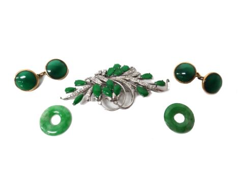 A white gold, jade and diamond brooch, designed as a spray, mounted with pear shaped jades and with small circular cut diamon