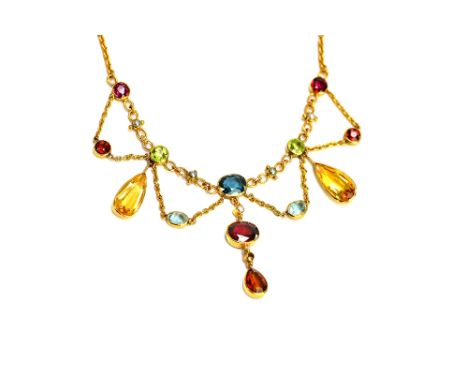 A gold, coloured gemstone and half pearl set necklace, the front in an undulating design, the variously cut coloured gemstone