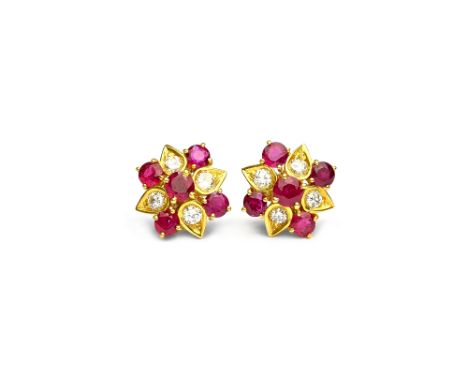 A pair of gold, ruby and diamond cluster earstuds, each claw set with five circular cut rubies and mounted with four circular