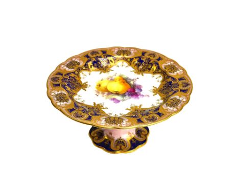 A Royal Worcester part dessert service, circa 1912, painted with studies of fruit, signed 'Cole', within deep blue and pale p