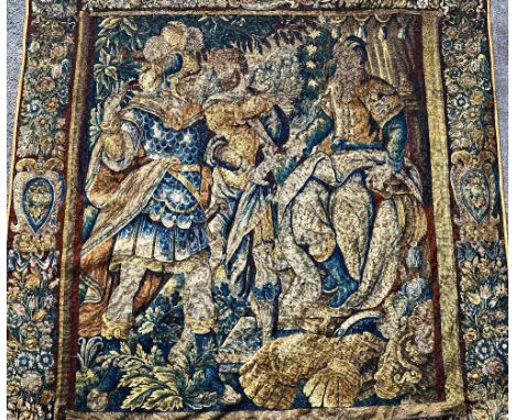 A verdure tapestry, late 17th Century, woven in wools, depicting a cuirassed warrior wearing plumed helmet and two other figu
