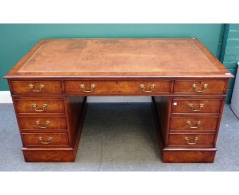 An 18th century style pollard oak pedestal desk, with nine drawers about the knee, 152cm wide x 76cm high x 91cm deep.