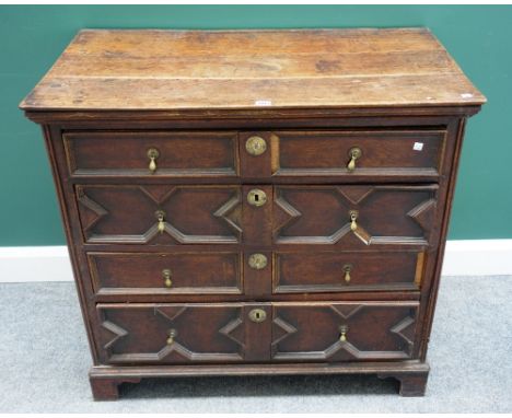 A late 17th century geometric moulded oak chest of four long graduated drawers, on bracket feet, 97cm wide x 91cm high. 