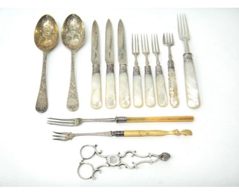 Silver and silver mounted wares, comprising; a pair of scissor action sugar tongs, crest engraved, circa 1800, three dessert 