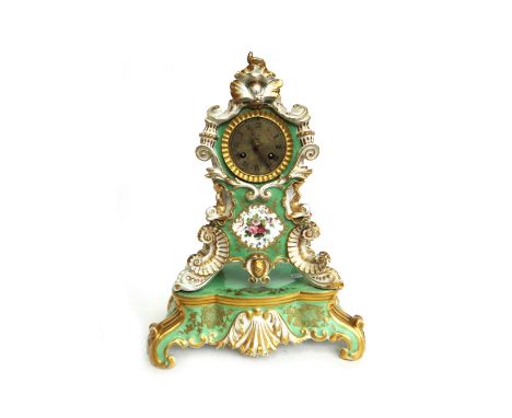 A French porcelain mantel clock, late 19th century, in the manner of Jacob Petit, moulded with shells, dolphins and flowers a