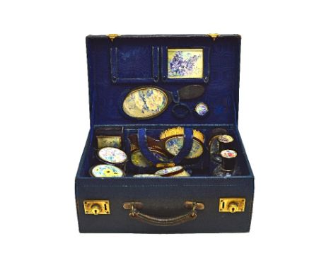 A French tortoiseshell travelling part toilet set, with a blue leather case, comprising; fifteen pieces to include a pair of 