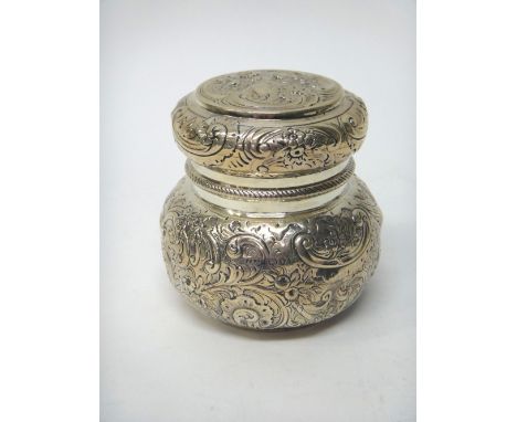 A Victorian silver tea caddy, of bun form, embossed with birds, floral and foliate scrolls, the pull-off lid with a China man