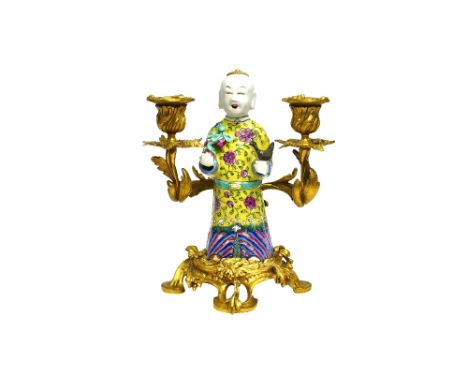 A French ormolu mounted Chinese famille rose porcelain two light candelabra, possibly by Escalier de Cristal, modelled with a